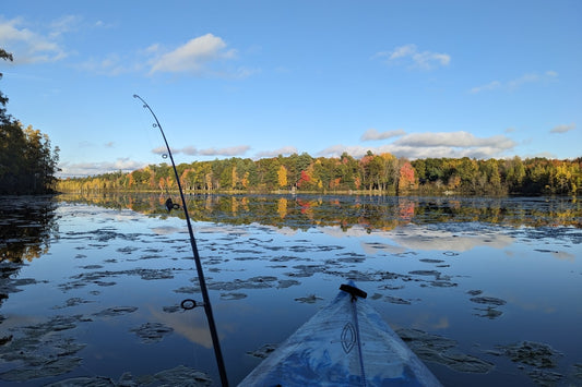 Beginner fishing outdoors by a lake in nature