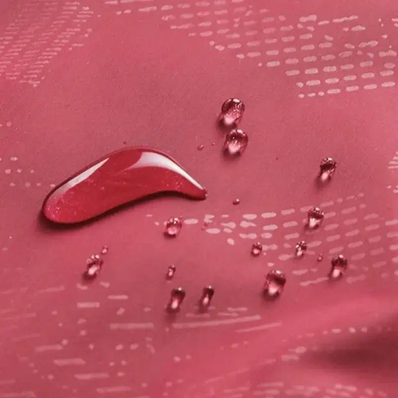Close-up of water droplets on affordable rain gear fabric from The Fishing Gear Shop