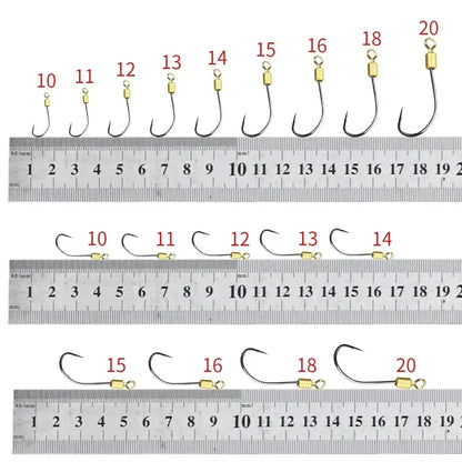 Various sizes of double hook rigs for fishing displayed with a ruler for precise measurement