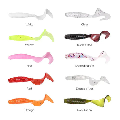 Assorted curly tail fishing lures in various colors including red, black and red, and clear options