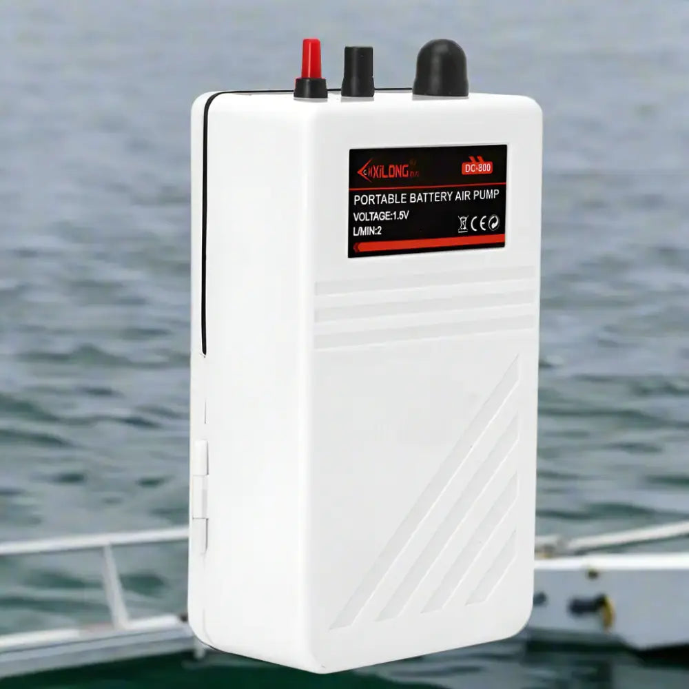 Compact portable fish airator for oxygenating water during fishing trips, designed for easy transport