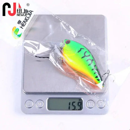Premium crank bait fishing lures displayed on a digital scale showing 15.9 grams for accurate weight