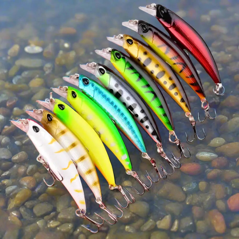 Variety of slow minnow lures set displayed on a rocky surface for effective fishing