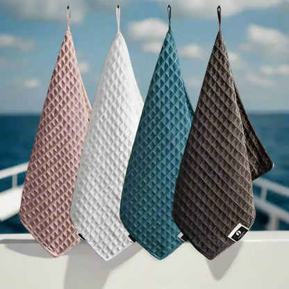 Collection of super absorbent fishing towels in various colors for efficient drying on fishing trips