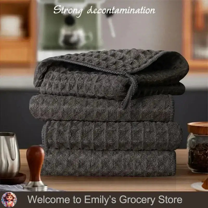 Stack of super absorbent fishing towels in dark gray for effective drying and cleaning during fishing trips